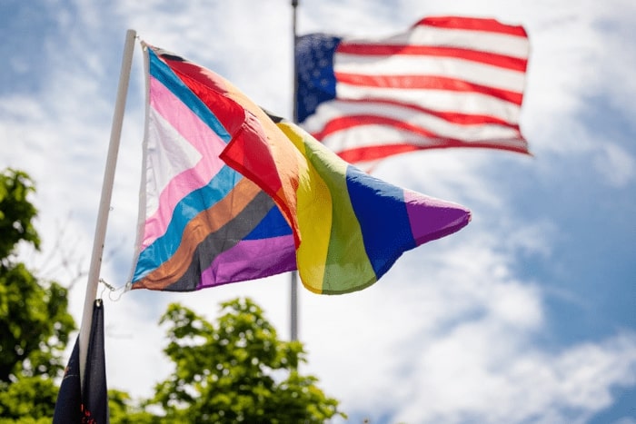 An equality flag and an American flag.