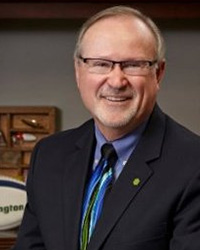 Dan Stoudt, the awardee of the Alumni Service Recognition Award, wearing a suit and tie.