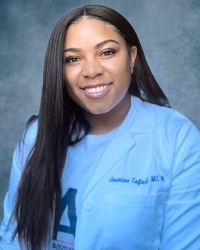 Jasmine Cofield's professional headshot photo wearing her white medical jacket.