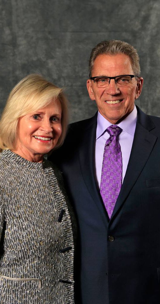 Smith a man and woman smiling for a picture