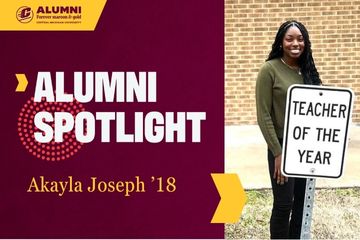 A CMU Alumni Spotlight graphic featuring a photo of Akayla Joseph, '18, standing behind a teacher of the year sign in a green shirt.