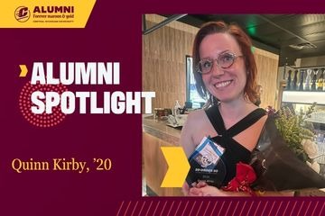 Central Michigan University Alumni Spotlight graphic featuring Quinn Kirby, class of 2020, holding a 30 Under 30 award plaque and a bouquet of flowers.