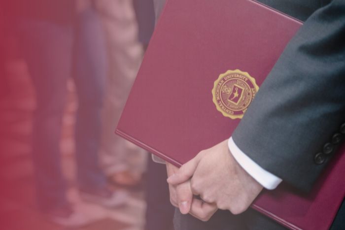 A portfolio with the CMU presidential seal stamp.