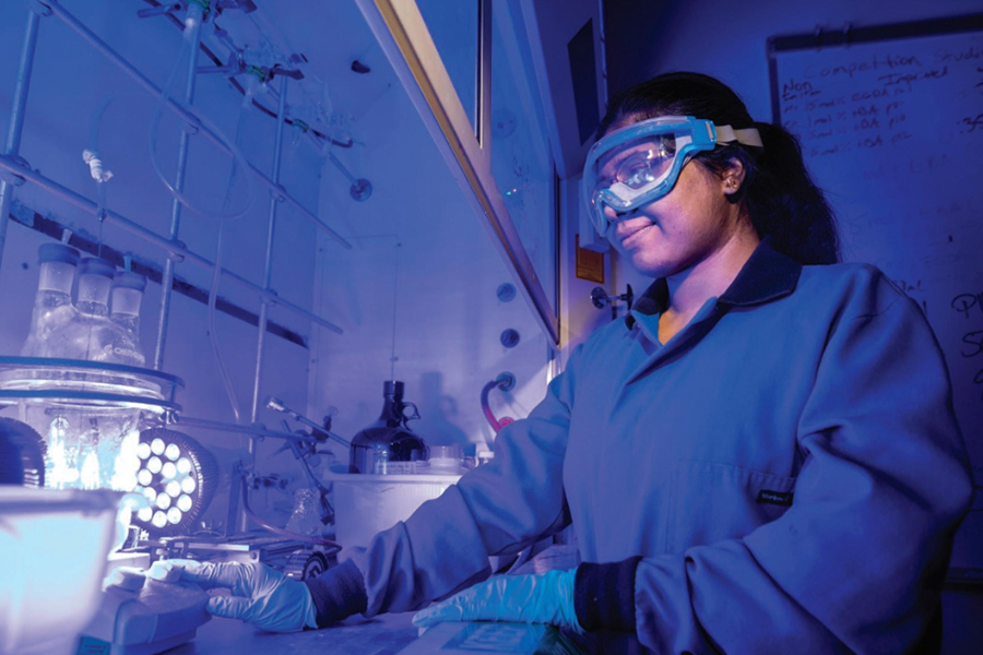 This is a photo of a CMU student working in a lab.