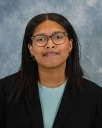 200x250 26-10-16_LaNiya Jones-8 La'Niya Jones, COMPASS Peer Educator headshot. Professional photo of individual with dark hair, glasses, blue shirt with black blazer in front of a blue background.