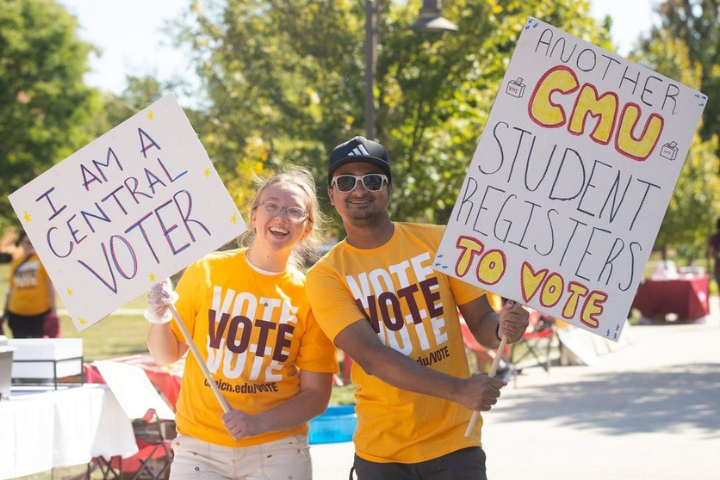 Students for Central Votes holding signs that read 