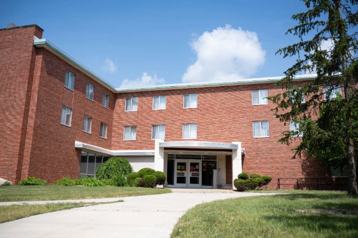 Beddow Hall exterior shot with a tree in the foreground.