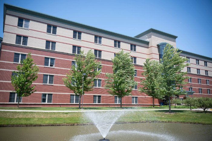 CelaniHall700x467 Wide view of Celani Hall's exterior, showing five floors of tan and red brick with evenly spaced windows.