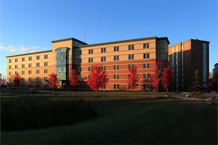 KesselerHall-700x467 Exterior shot of Kesseler Hall during fall season.