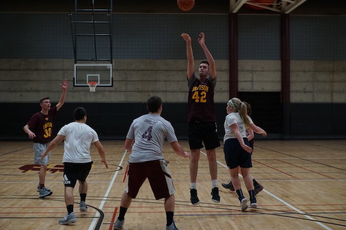 Students playing Basketball in sports forum